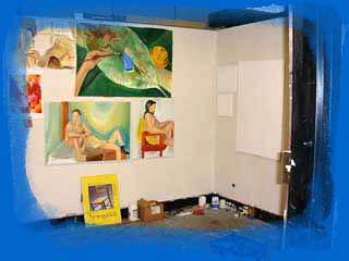 My studio cluttered with paintings