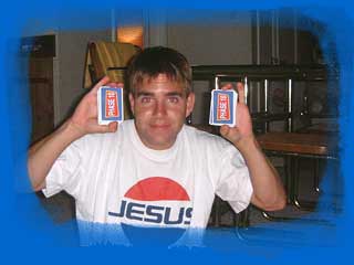 Chris holding up a pair of "Phase 10" cards